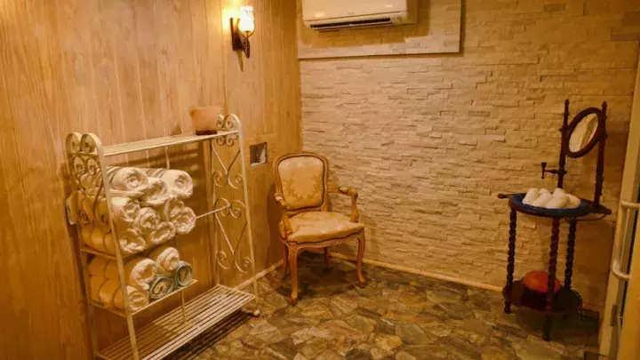 A spa room with low lighting.