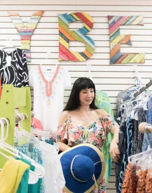 A woman shopping in a clothing store.