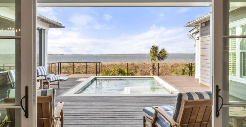 A view of an outdoor pool outside a large beach home on Tybee Island, GA.